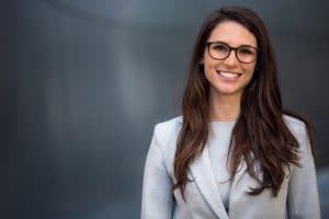 Smart, intelligent, friendly, likable portrait of an executive business woman manager, advisor, agent, representative with glasses